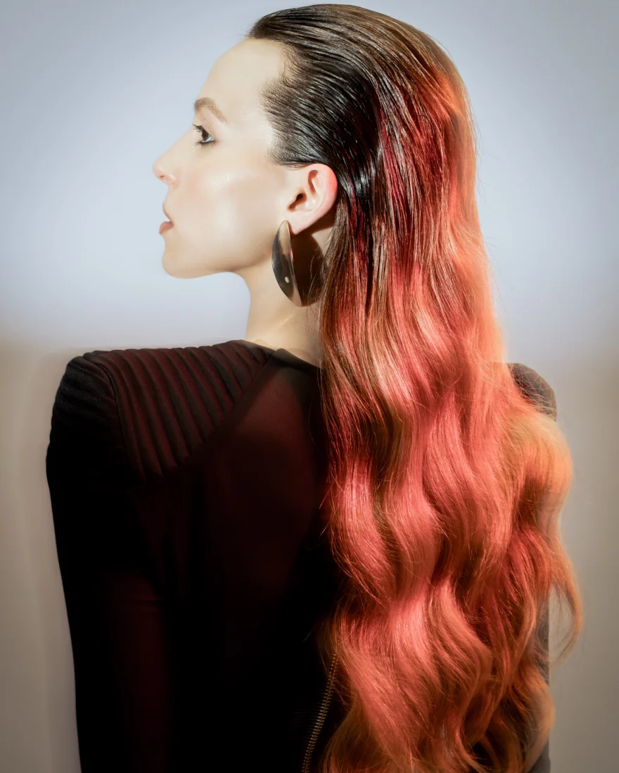 Back view of long hair with a coral ombré against black tailoring, Philip Martin's campaign photographed by Ina Cenusa