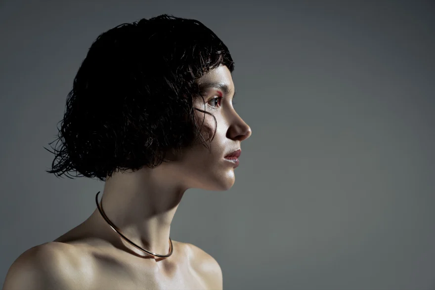 Profile of a short dark bob against a grey backdrop, Philip Martin's campaign photographed by Ina Cenusa