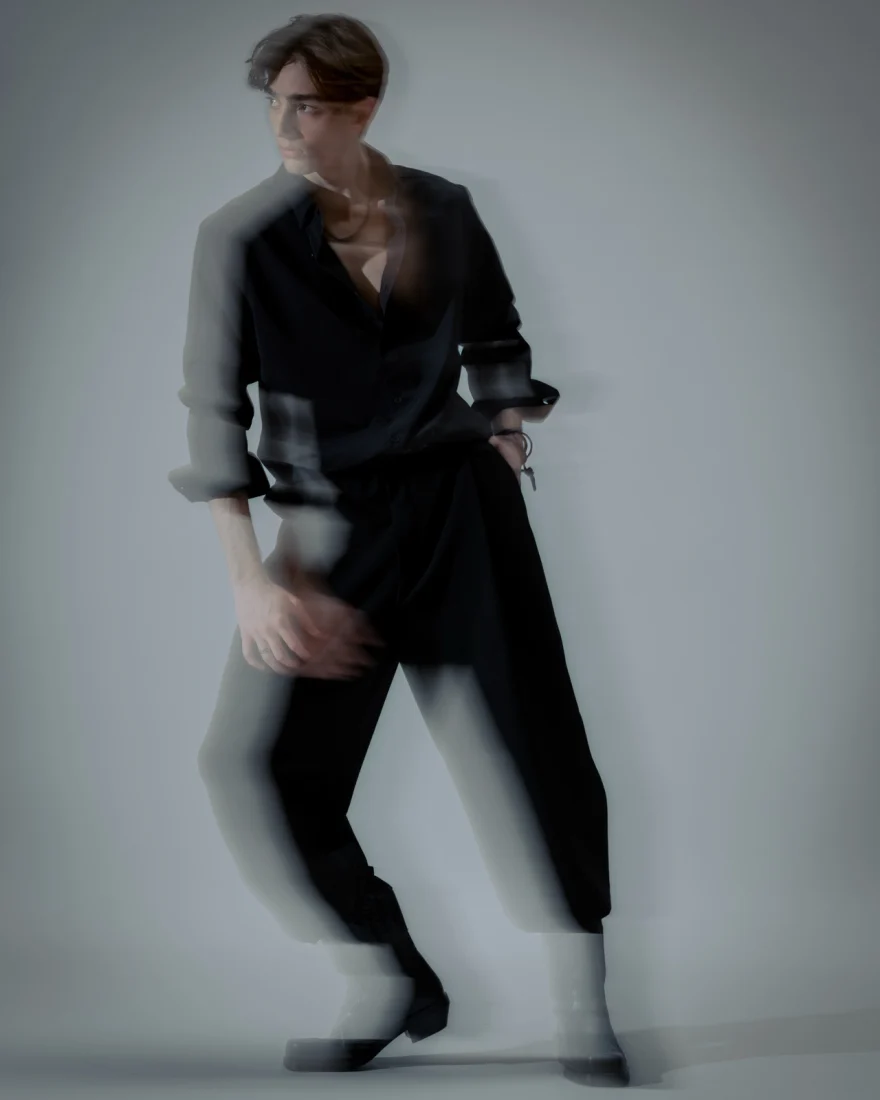 Motion-blurred figure in black tailoring, Philip Martin's campaign photographed by Ina Cenusa