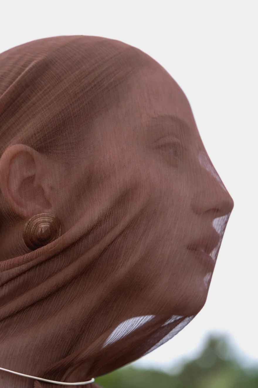 Profile wrapped in sheer nude fabric with a spiral earring showing through, sculptural beauty study, SHOT Magazine editorial photographed by Ina Cenusa
