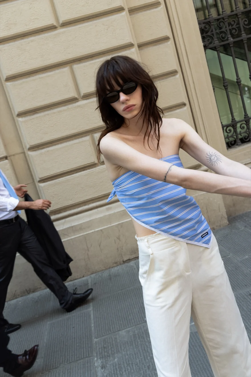 Model in a striped bandeau top and white trousers, Patrizia Pepe campaign photographed by Ina Cenusa