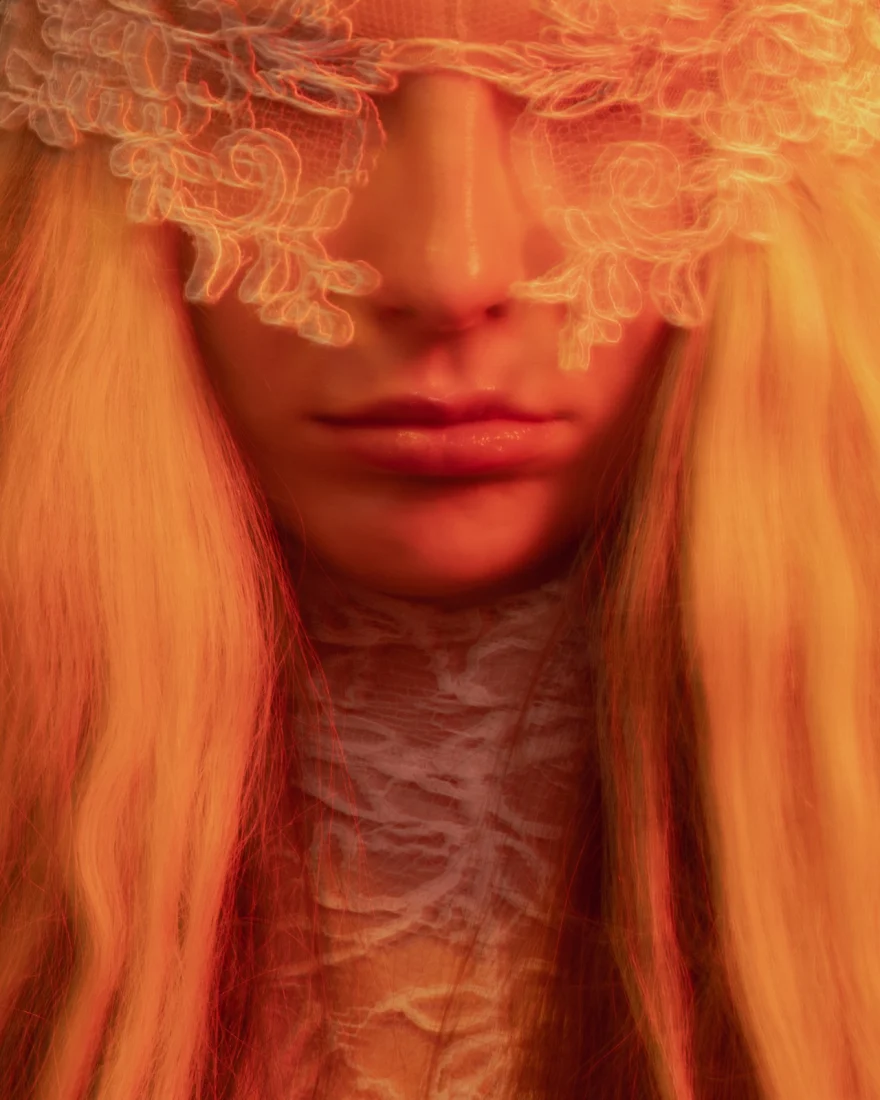 Close-up of a model with a lace veil over the eyes in warm amber light, SHOT Magazine editorial photographed by Ina Cenusa