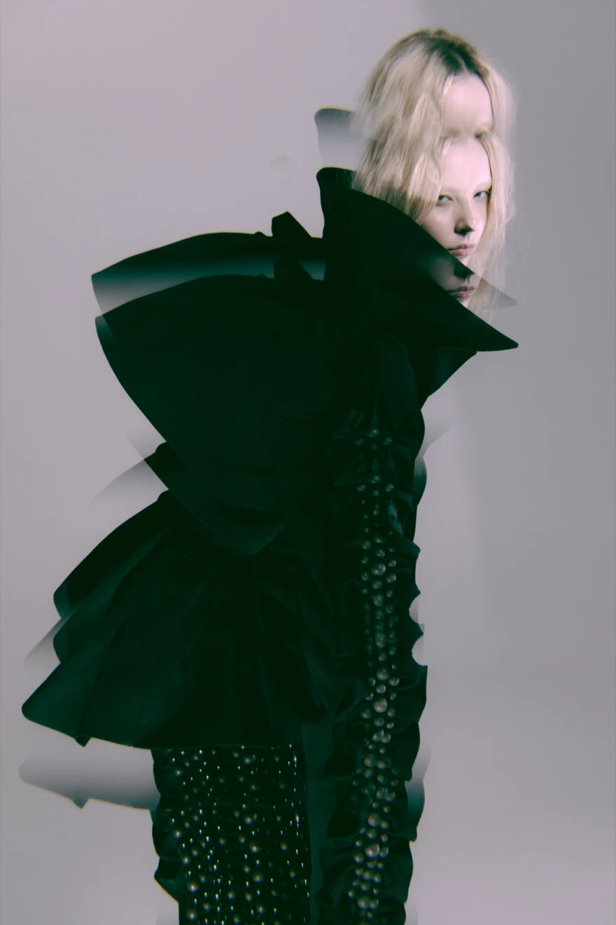 Model glancing over a sculptural black shoulder piece, fragmented double exposure, SHOT Magazine editorial photographed by Ina Cenusa