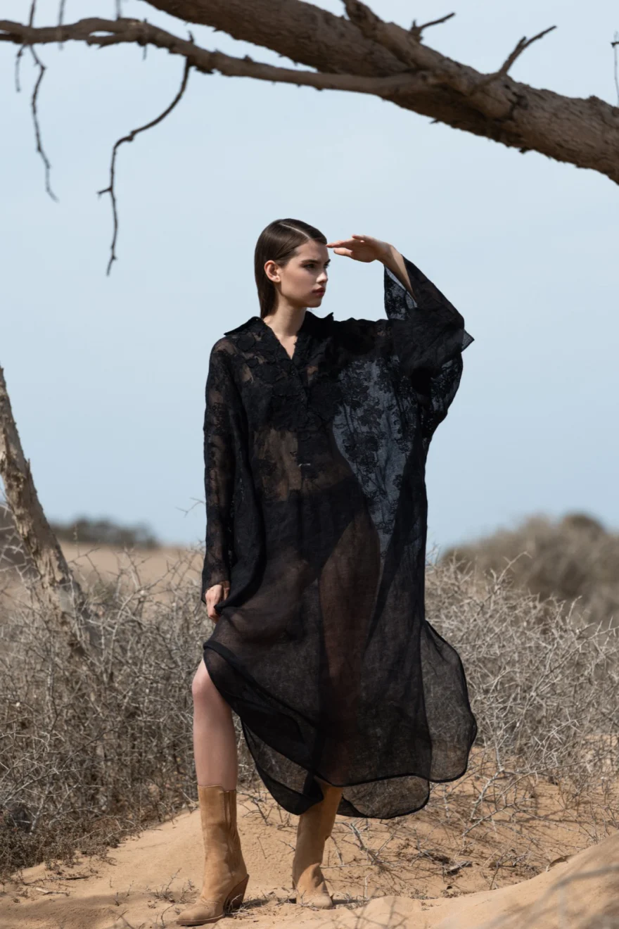Sheer black dress beneath a bare desert tree, Ermanno Scervino campaign photographed by Ina Cenusa