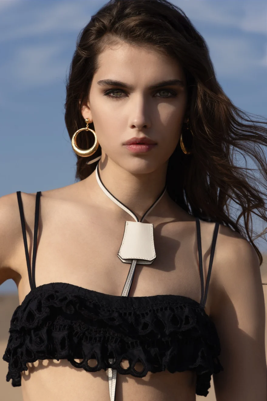 Beauty portrait with black crochet bandeau, oversized hoop earrings and pendant necklace, Ermanno Scervino campaign photographed by Ina Cenusa
