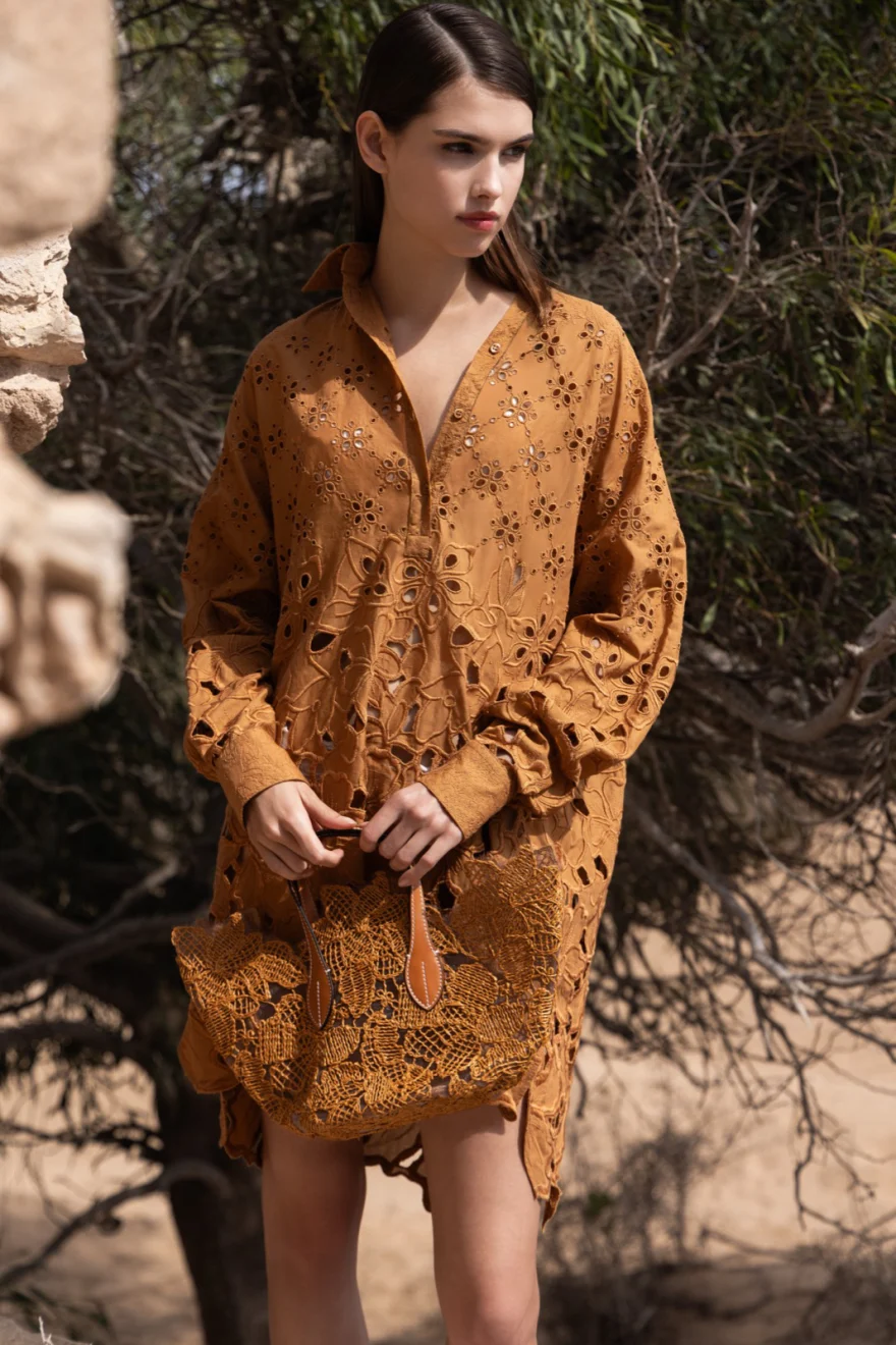 Ochre printed shirt dress against weathered stone ruins, Ermanno Scervino campaign photographed by Ina Cenusa