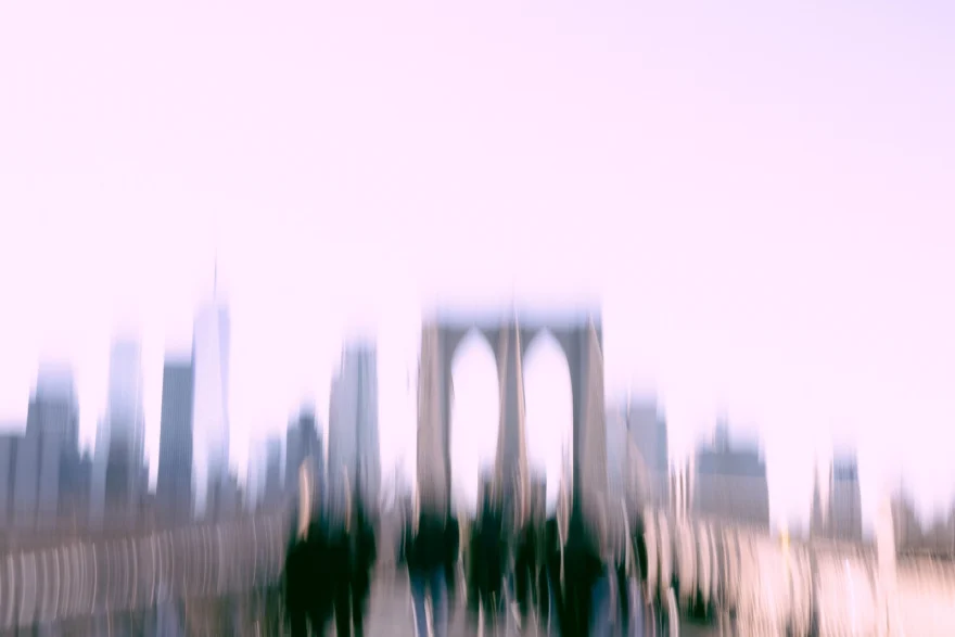Brooklyn Bridge and the Manhattan skyline blurred into a pale wash of light, New York, personal project photographed by Ina Cenusa