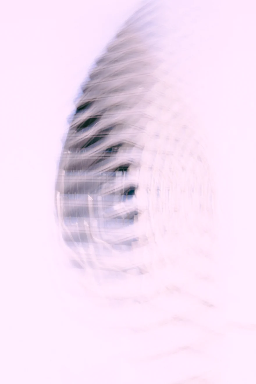 Curved honeycomb facade of a New York building dissolving into white, abstract architecture study, personal project photographed by Ina Cenusa