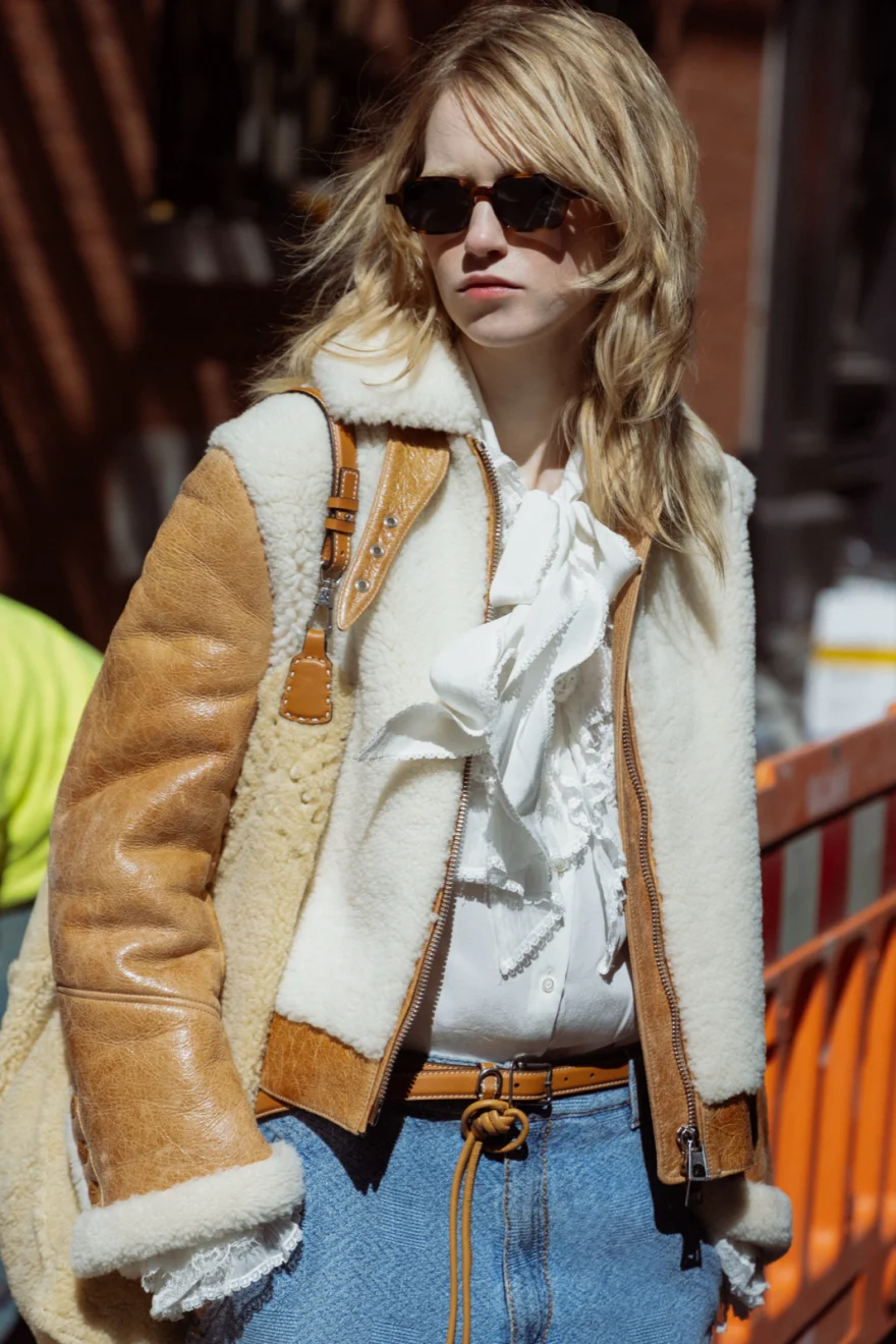 Model on the steps of a brownstone building, Ermanno Scervino campaign photographed by Ina Cenusa