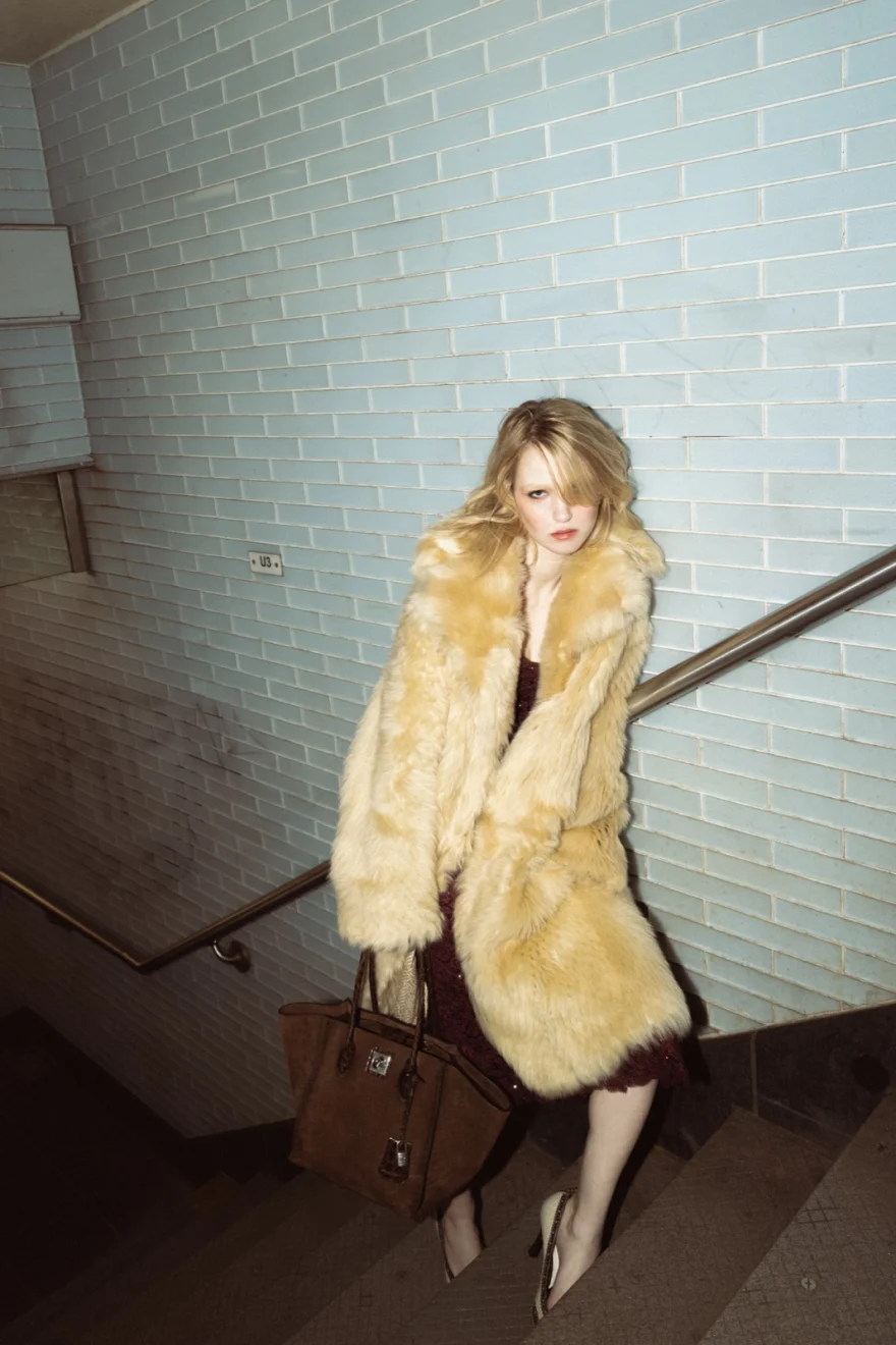 Model in a burgundy slip dress under the fur coat, Ermanno Scervino campaign photographed by Ina Cenusa