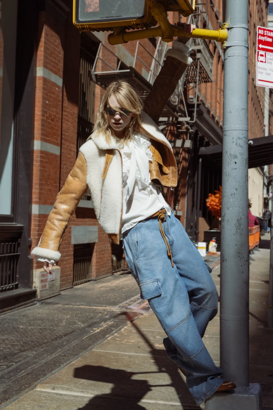 Model in a camel coat crossing a city street, Ermanno Scervino campaign photographed by Ina Cenusa