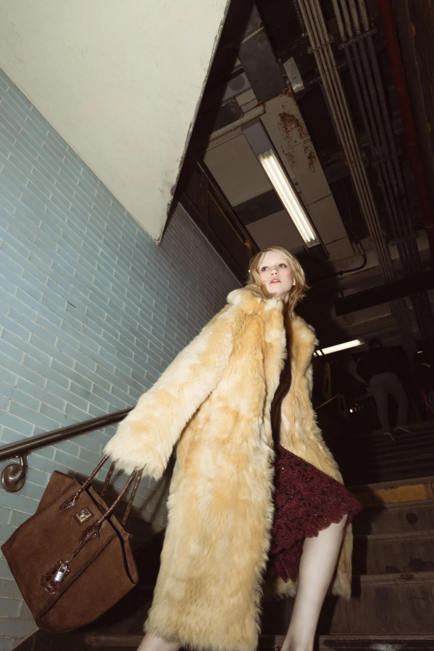 Model climbing the station stairs in a fur coat, Ermanno Scervino campaign photographed by Ina Cenusa
