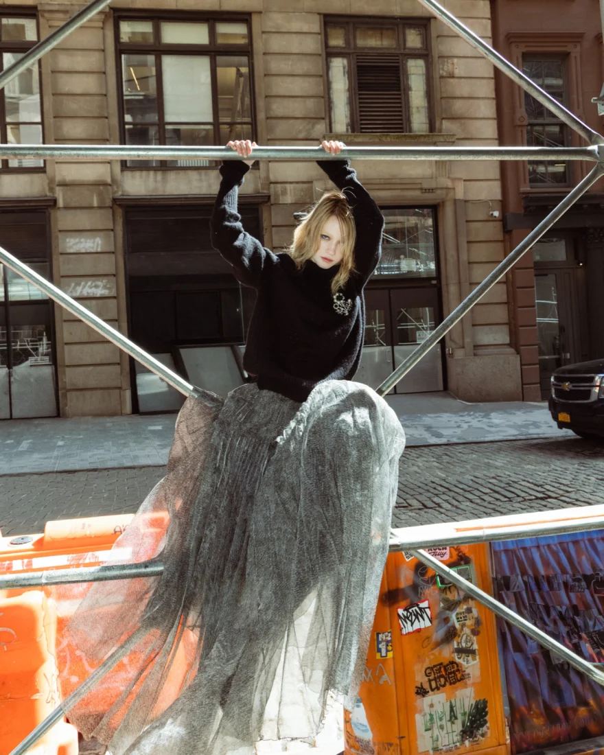 Model in a shearling jacket and denim on a sunlit street, Ermanno Scervino campaign photographed by Ina Cenusa