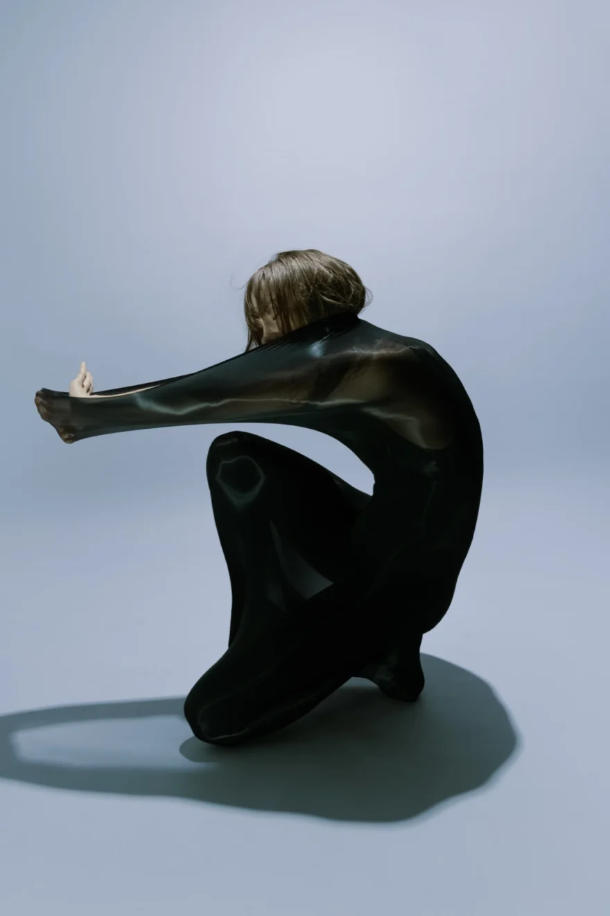 Sculptural black form against a grey ground, Fanny Sage photographed by Ina Cenusa