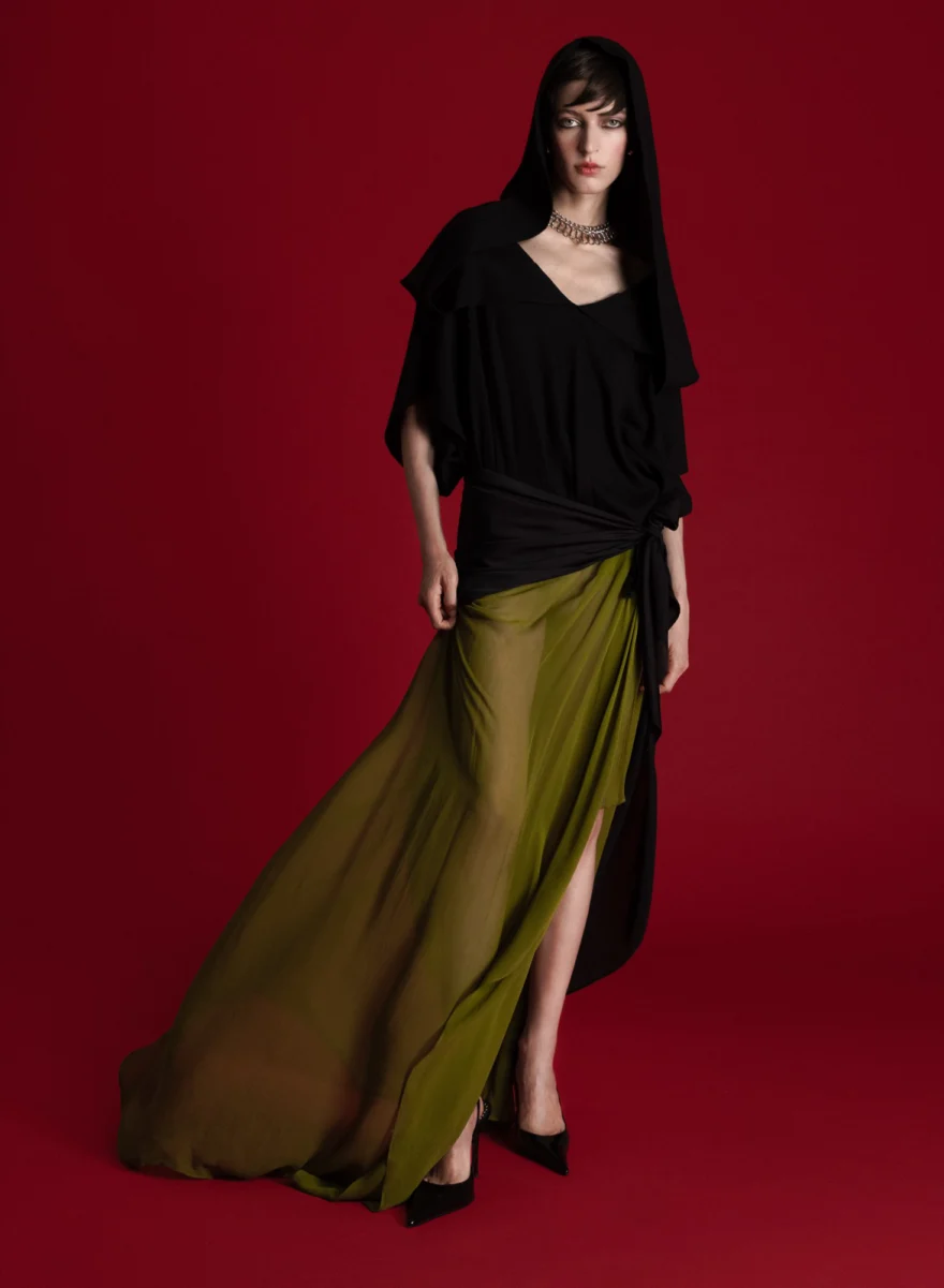 Black top and long olive skirt against a deep red backdrop, SHOT Magazine editorial photographed by Ina Cenusa