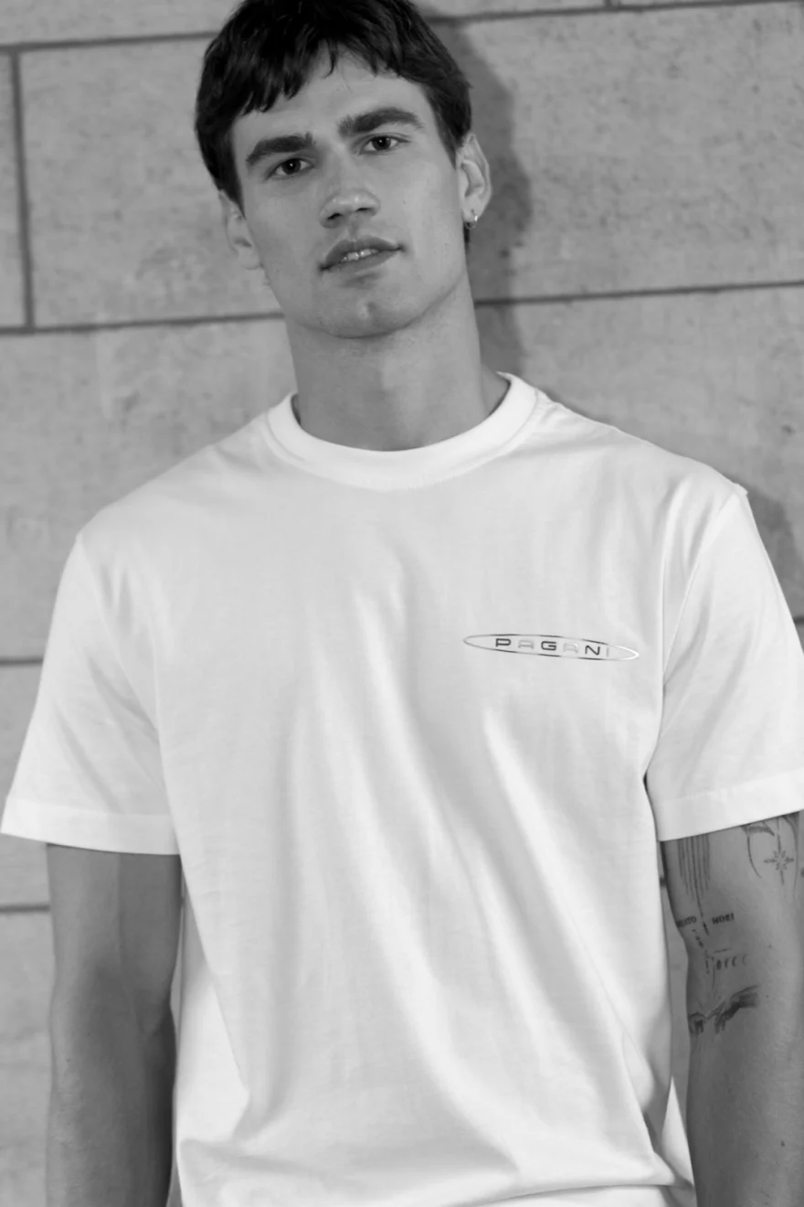 Black and white portrait of a male model in a white tee, Pagani campaign in Geneva photographed by Ina Cenusa